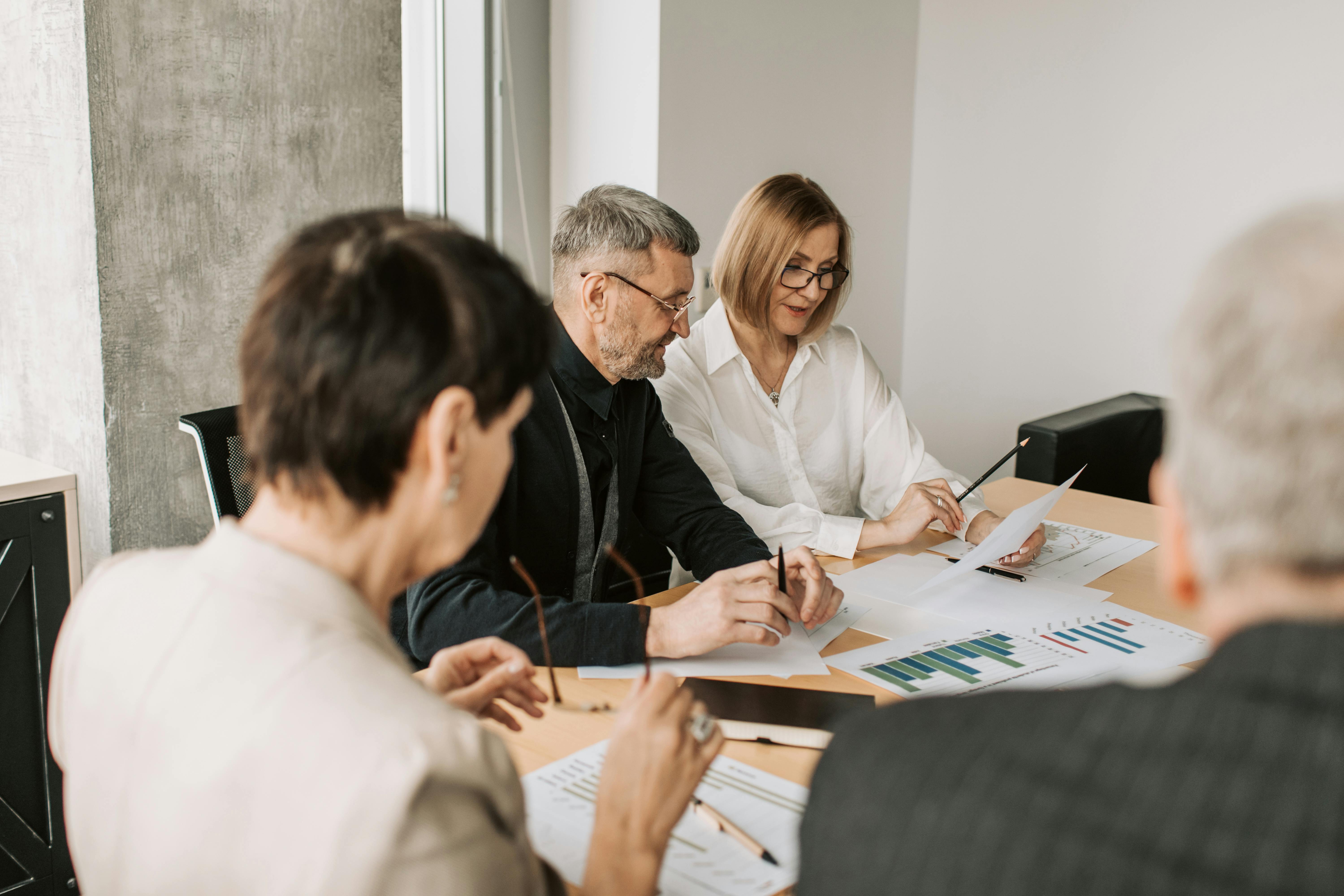 Executive leadership meeting discussing AI adoption